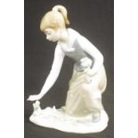 Lladro girl picking flowers kneeling figurine