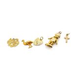 Five yellow gold charms