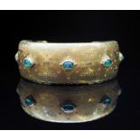 Emerald and 18ct yellow gold cuff bangle