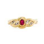 Red gemstone, diamond and 9ct yellow gold ring