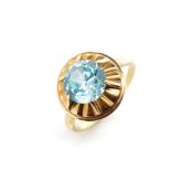 Blue gemstone and yellow gold ring