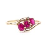 Red gemstone and 9ct yellow gold ring