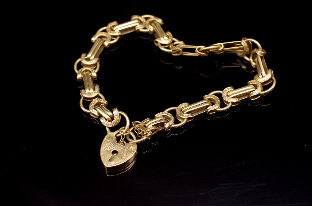 Fancy link 9ct yellow gold bracelet and heart