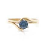 Blue gemstone and 9ct yellow gold ring