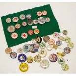 Box of various vintage tin badges