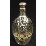 Silver encased glass spirit decanter