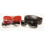 Two pairs of of Prada Italian sunglasses