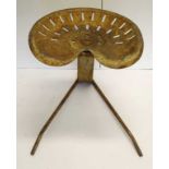 Rustic old iron stool