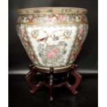 Chinese porcelain fish bowl on wood stand