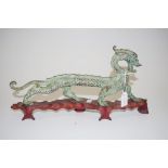 Chinese bronze dragon figure on wood stand