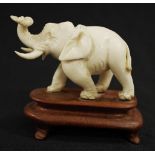 Oriental carved Ivory Elephant figure on stand
