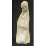 Lladro mother kneeling holding a baby figurine