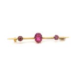Pink glass and yellow gold bar brooch