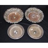 Two pairs silver plate wine bottle coasters