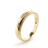 Three stone diamond and 9ct yellow gold ring