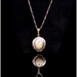 Sterling silver and shell set locket on a oval