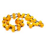 Long honey coloured resin bead necklace