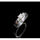 Three stone diamond and 18ct white gold ring