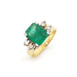 Emerald and diamond set 18ct yellow gold ring