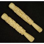 Two Oriental carved ivory cigarette holders
