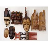 Eight tribal masks and carvings