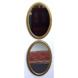 Pair of oval gilt framed mirrors