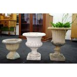 Three concrete urn garden pots