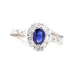 Sapphire and diamond set platinum halo ring