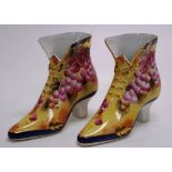 Pair of Limoges style porcelain boot figurines
