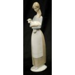 Lladro woman holding lamb figurine