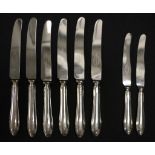 Eight sterling silver knives