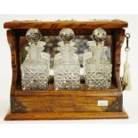 Vintage mini oak cased three decanter tantalus