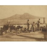 Gloeden, Wilhelm von: Nude youths on terrace with Naples harbor view in background