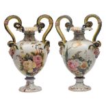 A pair of large Italian Le Nove faience two-handled baluster vases: each with double serpent and