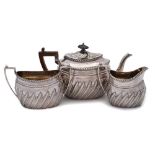 A Victorian bachelor's silver three-piece tea service, maker WPD, Sheffield,