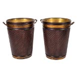 A pair of mahogany spirally reeded and brass banded twin-handled buckets of large size in the 18th