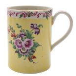 A First Period Worcester yellow ground cylindrical mug: of small size with grooved loop handle,