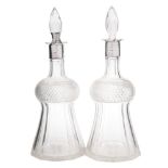 A pair of Victorian silver mounted and clear glass decanters, maker's marks worn, London,