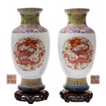 A pair of Chinese famille rose dragon vases: painted with dragons chasing gilt pearls amongst flame