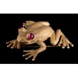 Zadora. A frog brooch: with cabochon ruby eyes stamped '14k, Zadora' approximately 34.5mm long, 17.
