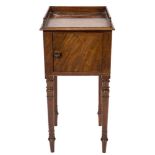 An early 19th Century mahogany pot cupboard:, with a three quarter ledge gallery,