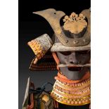 A Japanese Taisho Period O-yoroi (Samurai armour):, the kabuto with gilt brass mandate and mon,