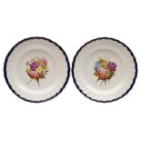 A pair of Derby plates: each painted in the manner of William Billingsley with a floral bouquet
