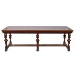 By James Shoolbred An Edwardian walnut dining table of refectory type:,