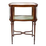 An Edwardian mahogany and inlaid bijouterie display cabinet:, of serpentine outline,