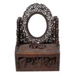 A Chinese carved wood toilet mirror: of arched outline,