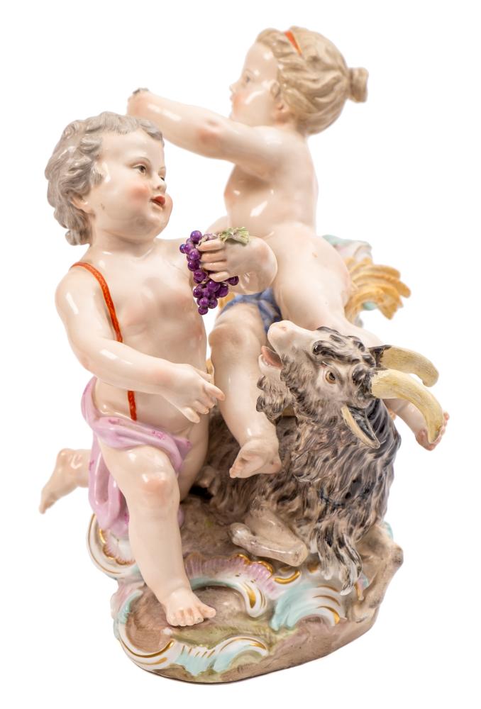 A Meissen group representing Summer and Autumn: in the form of two putti,