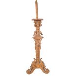 An Italian carved walnut floor lamp:,