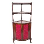 A late 19th Century mahogany serpentine fronted three tier corner whatnot/encoigneur:,