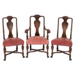 A set of six Edwardian carved oak dining chairs in the Queen Anne taste:,
